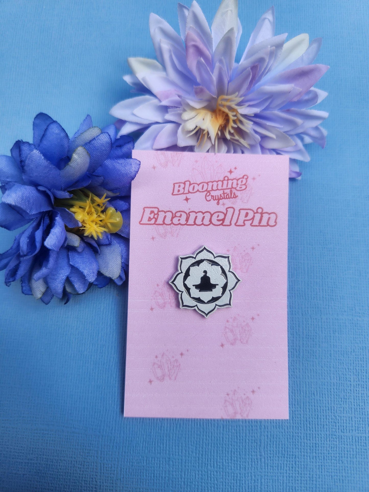 Meditation lotus enamel pin featuring white lotus flower with black meditating figure in centre, spiritual mindfulness design for yoga and meditation lovers, calming zen aesthetic enamel pin, chakra inspired accessory for inner peace and balance, cute lapel pin for bags jackets and pin boards