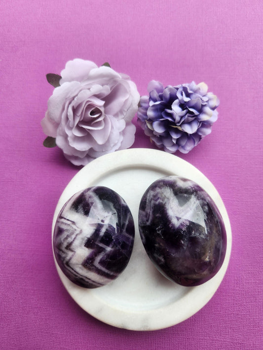 Amethyst palmstones featuring polished natural amethyst crystal, healing gemstone palm stones known for calm stress relief intuition and spiritual protection, metaphysical crystals perfect for meditation sleep support gifting altar decor and crystal collections