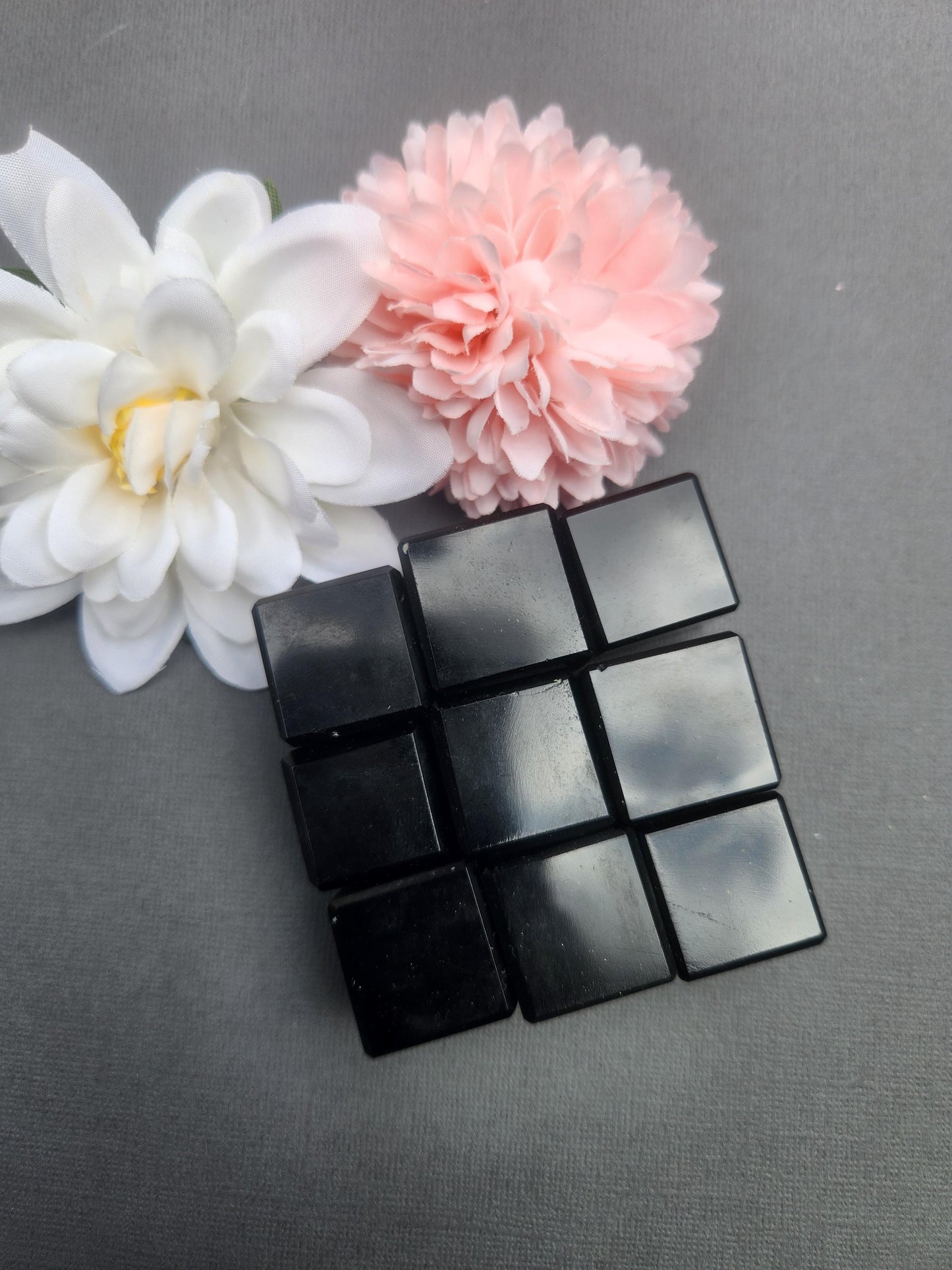 Polished Black Obsidian Cube crystal featuring deep black natural stone with smooth geometric cube shape. Grounding protection crystal ideal for meditation, crystal grids, spiritual practices, energy cleansing, home decor, desk display, chakra work, and crystal collections. Black Obsidian is known for protection, grounding, strength, and absorbing negative energy. Natural polished crystal cube for gifting, mindfulness, and metaphysical use.