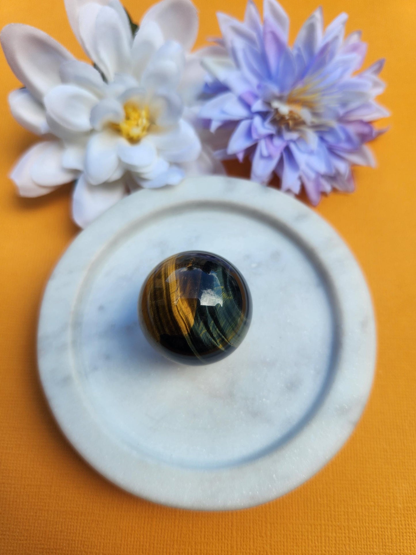 Blue Yellow Tigers Eye crystal sphere polished natural gemstone ball with chatoyant bands of golden yellow and deep blue flash, high quality Tigers Eye sphere for protection grounding confidence and clarity, round crystal sphere for meditation manifestation home decor energy cleansing and spiritual healing, genuine Tigers Eye mineral stone sphere with glossy finish and smooth surface, crystal ball for chakra balancing strength courage focus prosperity abundance desk decor gift