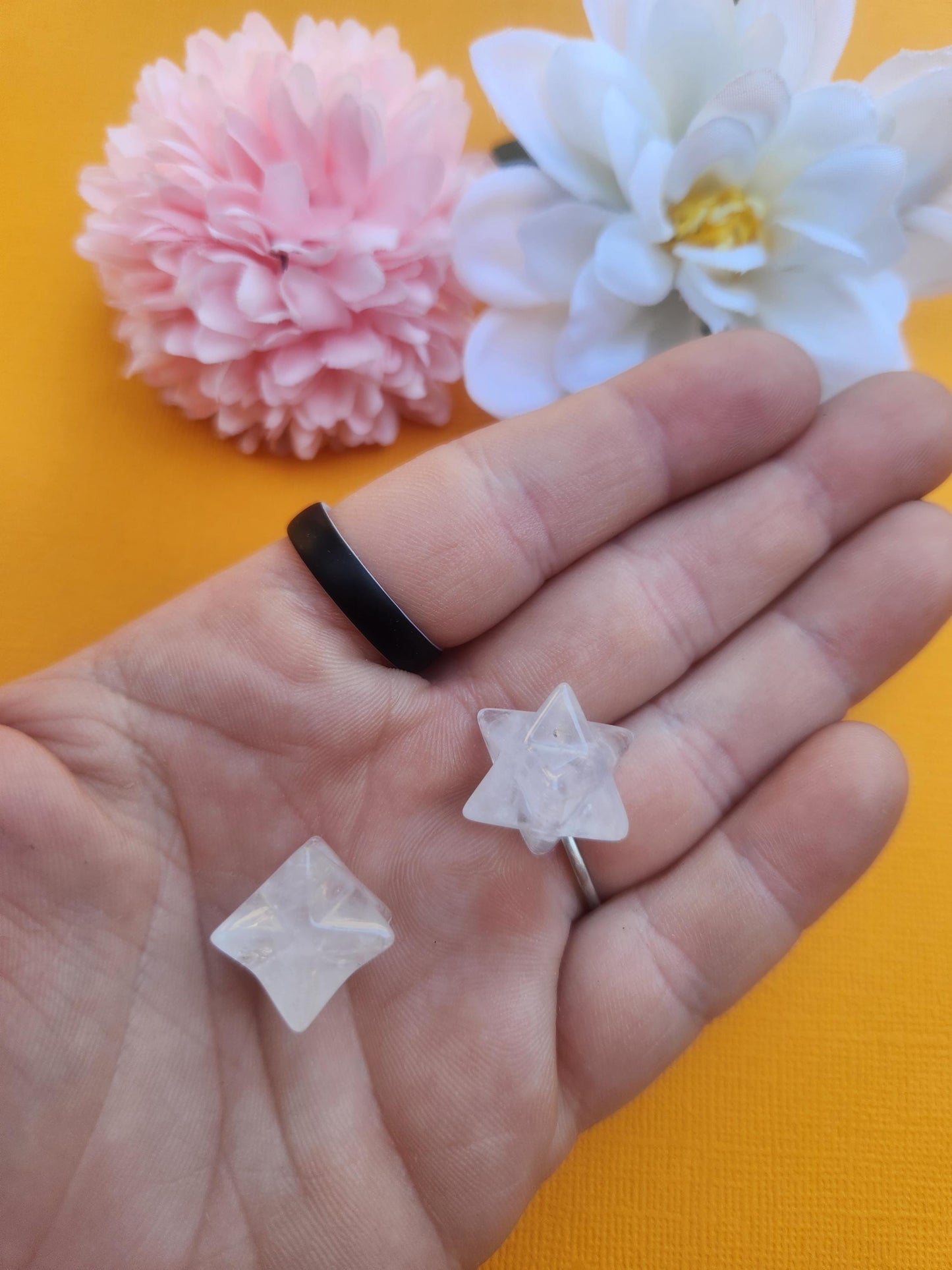 Clear quartz mini merkaba held in hand showing small size scale, polished crystal merkaba star with transparent quartz, energy amplification crystal for manifestation, clarity and chakra balancing, pocket size healing crystal for meditation, spiritual protection stone, everyday crystal carry
