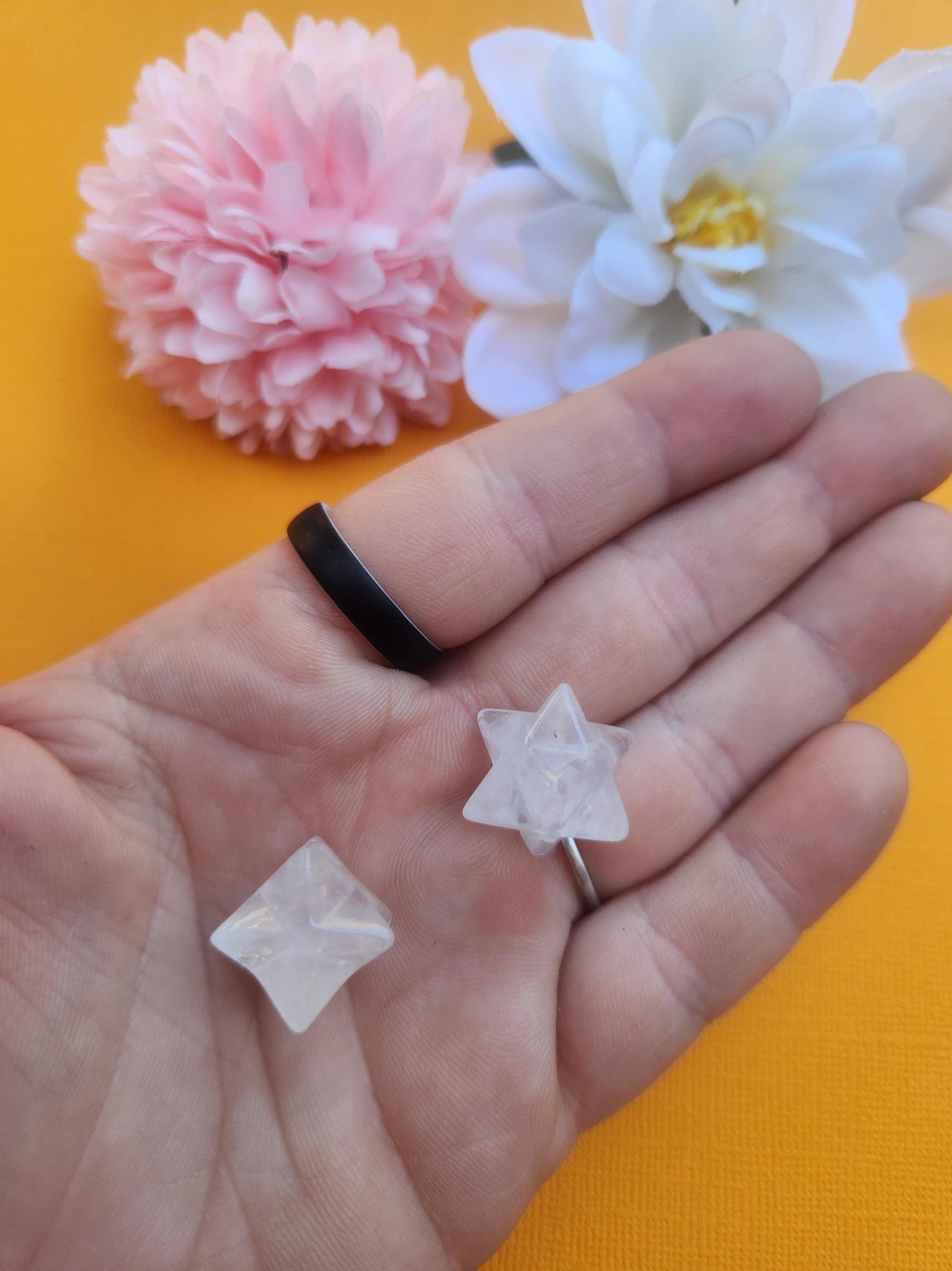 Clear quartz mini merkaba held in hand showing small size scale, polished crystal merkaba star with transparent quartz, energy amplification crystal for manifestation, clarity and chakra balancing, pocket size healing crystal for meditation, spiritual protection stone, everyday crystal carry