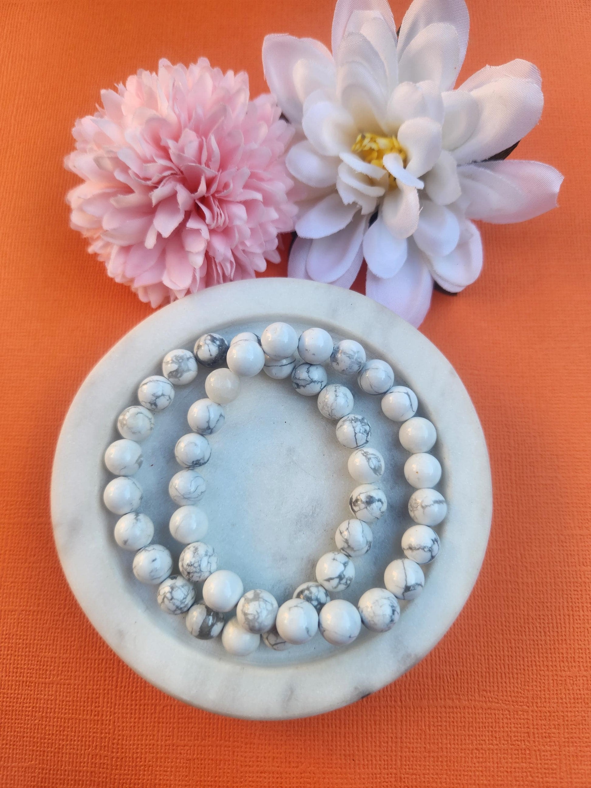 Howlite 8mm Beaded Bracelet featuring natural white Howlite gemstone beads with distinctive grey marbling on a comfortable stretch bracelet. Beautiful crystal jewellery associated with calm, patience, emotional balance, stress relief, mindfulness, meditation, and peaceful energy. Perfect for everyday wear, bracelet stacking, gifting, self care routines, crystal collections, and spiritual practices. Natural Howlite crystal bracelet with polished 8mm gemstone beads.