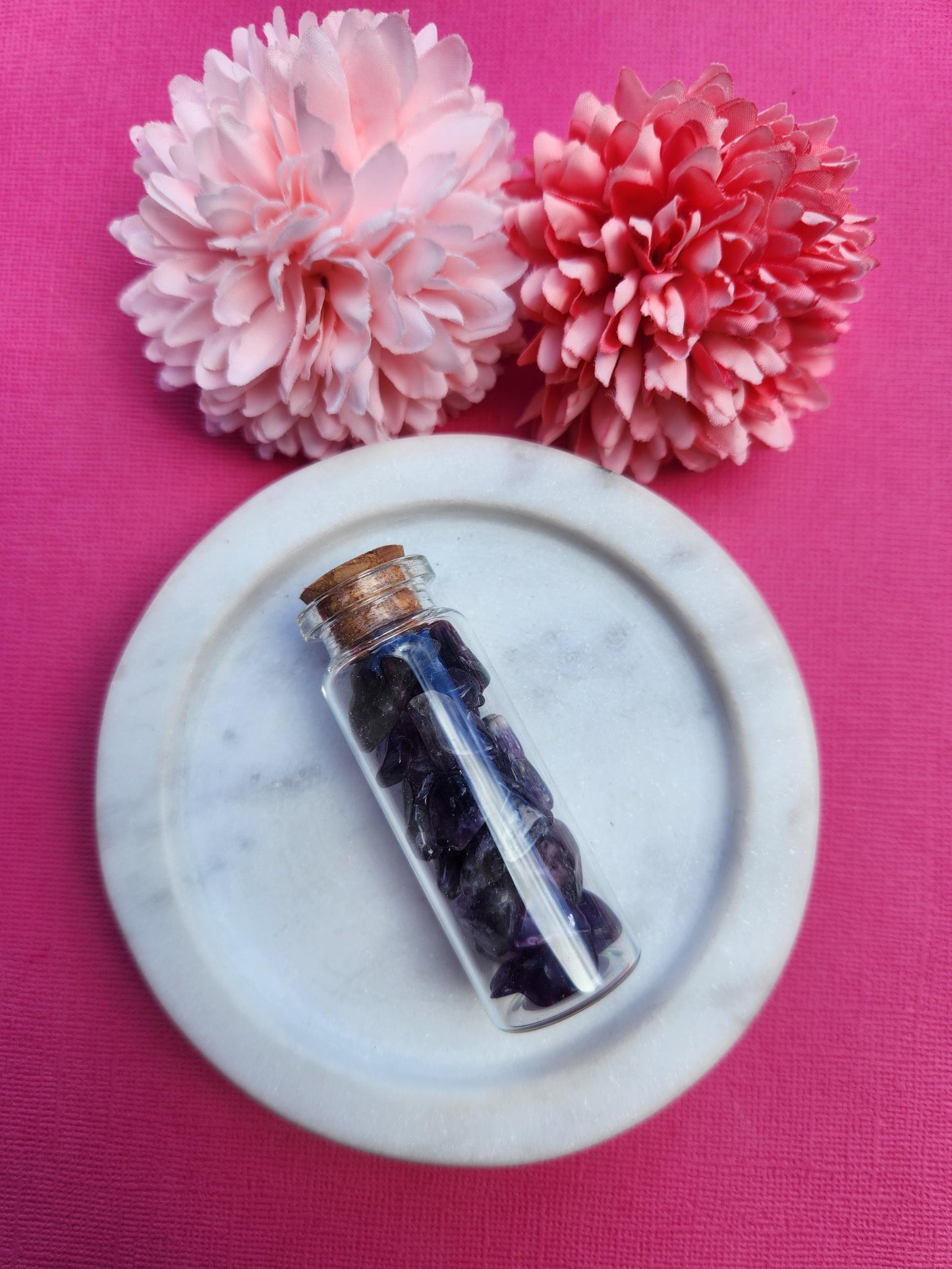 Amethyst crystal chip wish bottle filled with natural purple amethyst gemstone chips, mini glass bottle for spiritual decor meditation and manifestation, calming and intuitive healing crystals, crown chakra crystal chips, amethyst wish bottle photographed close up