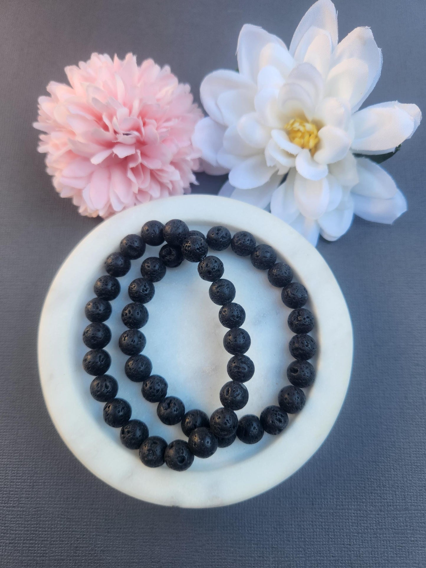 Lava Stone 8mm beaded bracelet handmade with natural black volcanic lava rock gemstone beads, stretchy crystal bracelet for grounding strength courage and emotional balance, genuine Lava Stone bracelet ideal for meditation mindfulness energy work and everyday wear, porous lava beads suitable for essential oil diffusion, unisex crystal jewellery with matte black finish, healing stone bracelet for protection stability and spiritual growth, gift for crystal lovers Australia shop.