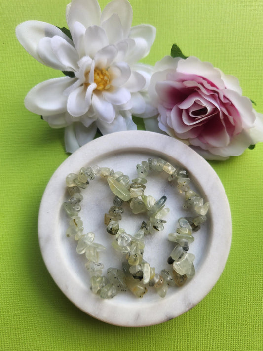 Prehnite chip bracelet featuring natural prehnite crystal chips on elastic, healing gemstone jewelry known for calm emotional healing intuition and heart chakra energy, metaphysical crystal bracelet perfect for daily wear meditation gifting and crystal lovers collections