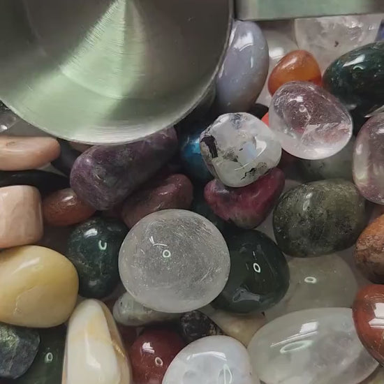 Close-up video of a 1/4 cup sample scoop of crystal tumbles only confetti being poured or held, featuring a minimum of 10 polished gemstone tumbles per scoop. Mixed colorful crystals displayed for spiritual healing, meditation, intention setting, chakra balancing, altar décor, crystal crafting, DIY resin art, metaphysical collections, and high-quality Etsy product listing SEO. Perfect for crystal lovers, collectors, and mystical home décor enthusiasts