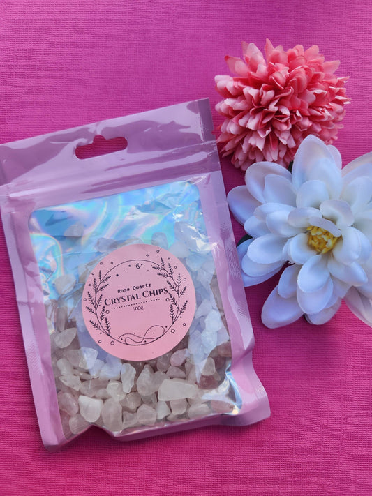 100g bag of natural Rose Quartz crystal chips, soft pink rose quartz gemstone chips for jewellery making, crafts and crystal confetti, raw rose quartz chip stones for resin art, spell jars and candle making, love and heart chakra healing crystals, rose quartz chips for manifestation and gifting, close up crystal chips photographed in clear packaging