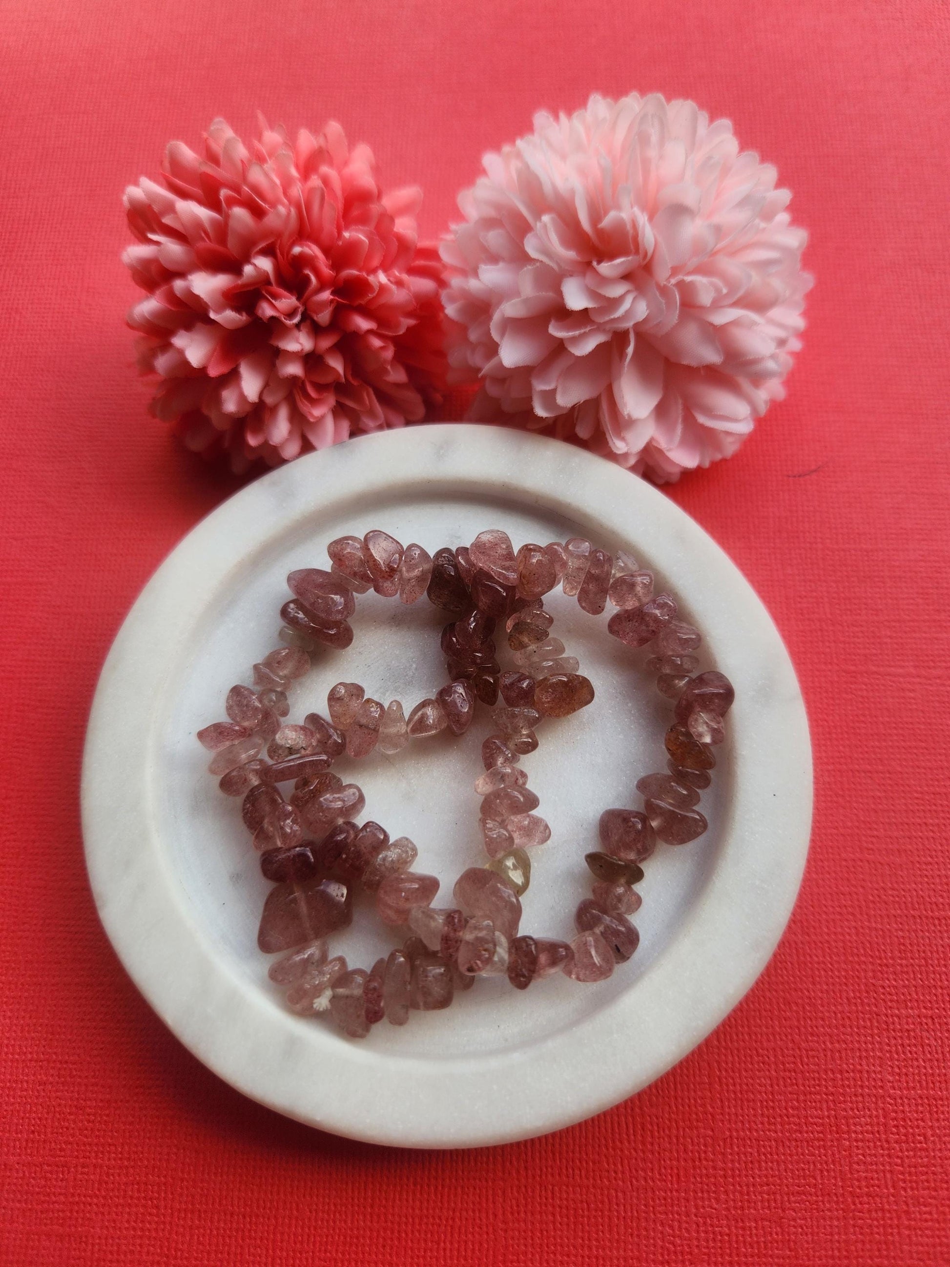 Strawberry Quartz chip bracelet featuring natural pale pink strawberry quartz crystal chips, stretchy crystal bracelet, delicate pink gemstone jewelry, handmade strawberry quartz bracelet for love, emotional healing and self worth, feminine crystal chip bracelet, dainty pink crystal bracelet, strawberry quartz jewelry for gifting, heart chakra crystal bracelet, boho gemstone bracelet photographed close up